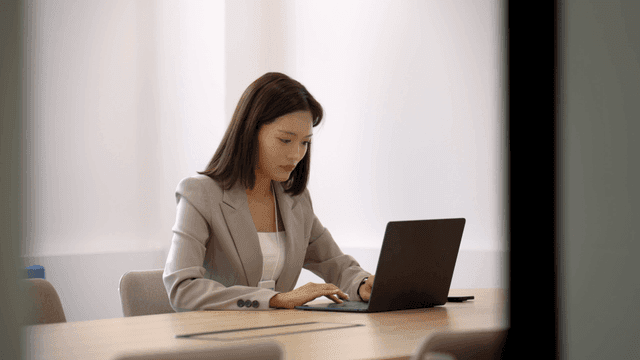 Working woman working on laptop in office
