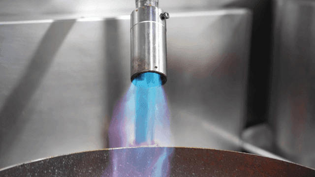 Gas burner with blue flame in kitchen