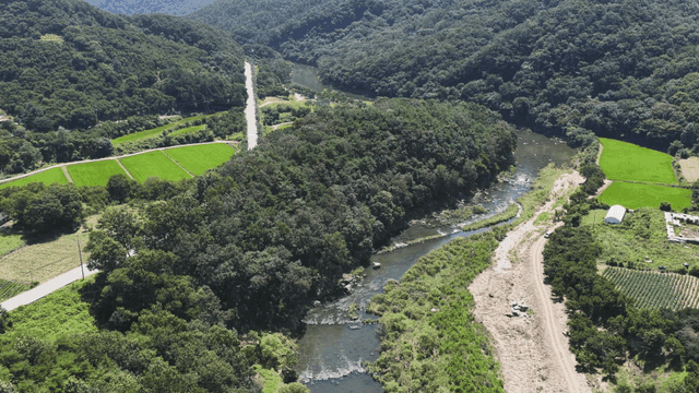 Beautiful river flowing through green fields