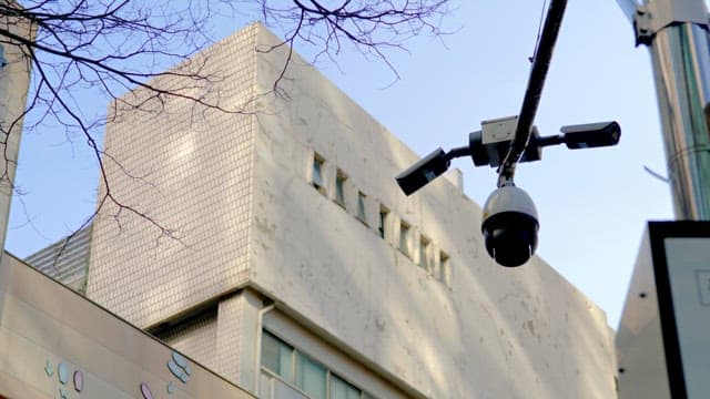 Surveillance camera installed in front of the building