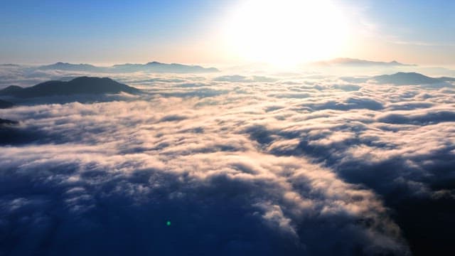 Sunrise over clouds and mountains