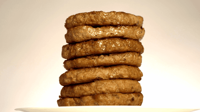 Stack of juicy grilled patties on a plate