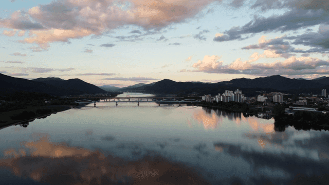 Tranquil river with bridges and cityscapes