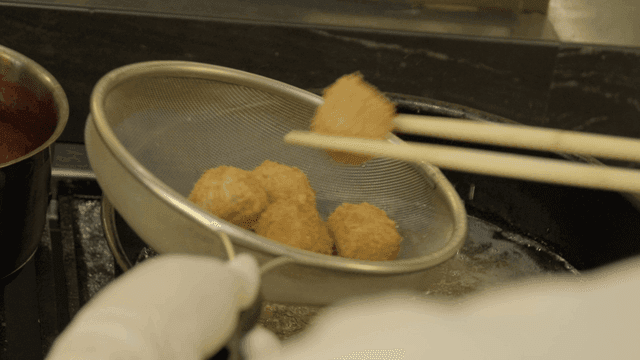 Chopsticks for dipping croquettes in hot oil