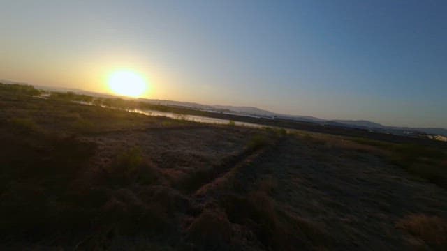 Sunrise Over a Calm Countryside Lake