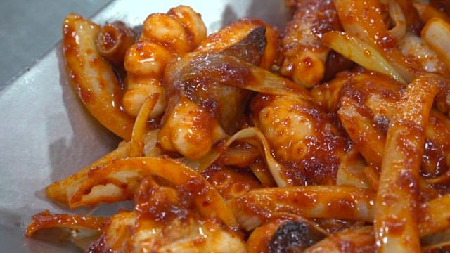 Sesame seeds sprinkled on delicious stir-fried octopus