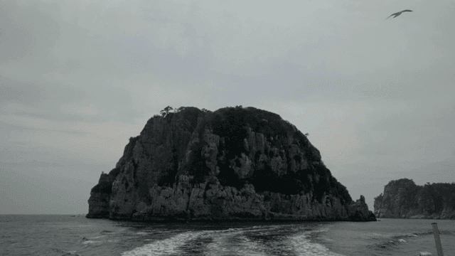 Rocky island surrounded by calm seas
