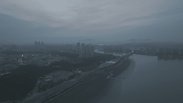 Night view of a city with riverside roads