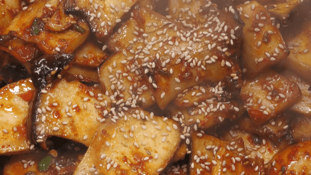 Stir-fried mushrooms sprinkled with sesame seeds