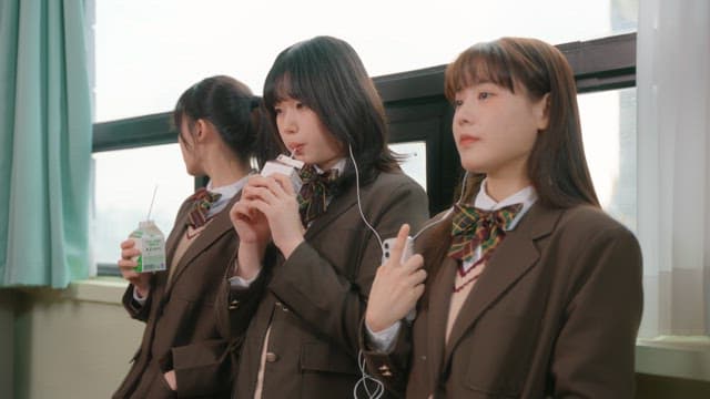 Students taking a break and drinking milk in the classroom