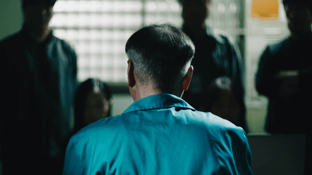 Back of prisoner giving statement to investigators