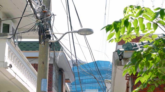 Streetlight and power lines in a city