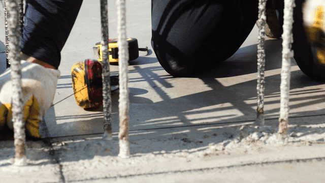 Worker using tools on a construction site
