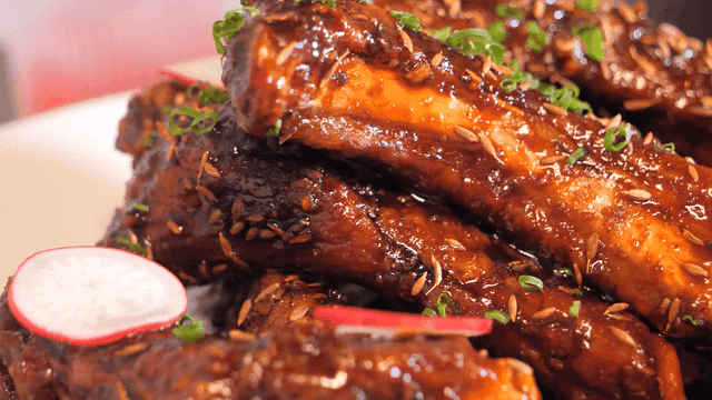 Delicious glazed marinated short ribs topped with scallions