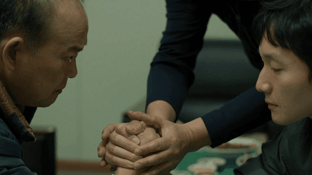 Two men arm wrestling