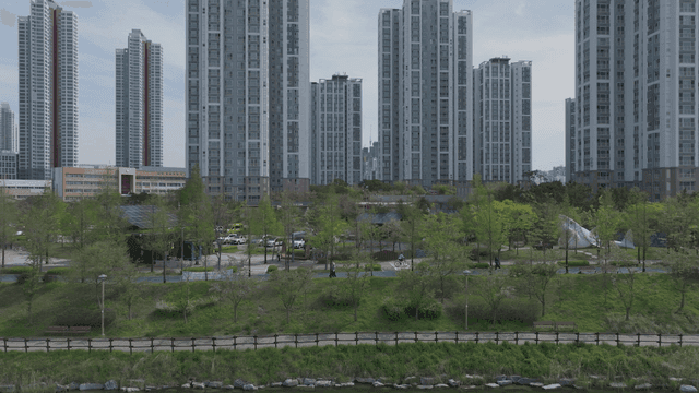 Cityscape with tall buildings and green park