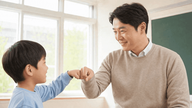 Teacher and student fist bumping in classroom