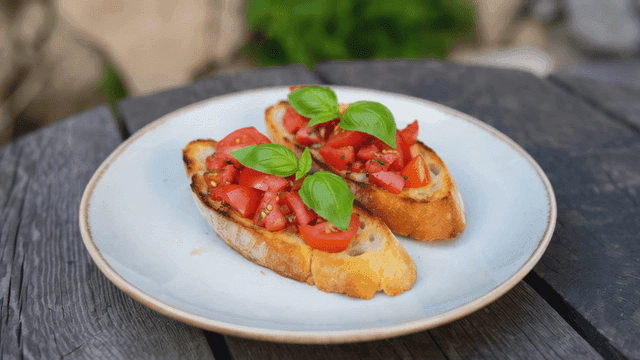 Bruschetta with tomatoes and basil on a plate