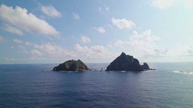 Scenic view of two rocky islands
