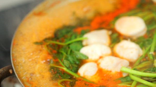 Stew with vegetables and puffer fish is boiling