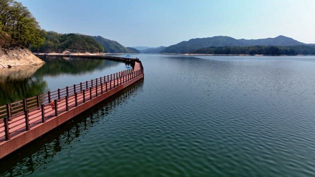 Peaceful lake with a wooden walkway