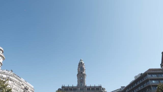 Square with City Hall and People Walking on a Sunny Day