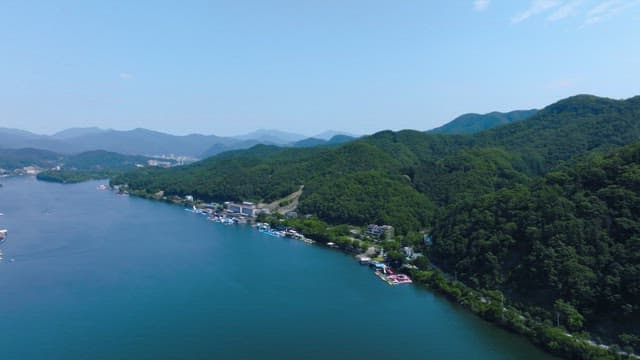 Greenery Mountains and Serene Lakeside Landscape