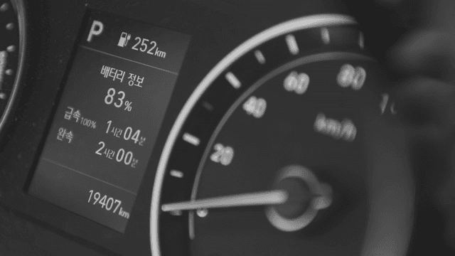 Car dashboard showing battery status