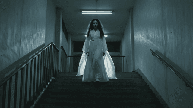 Ghost wearing traditional white Hanbok on stairs