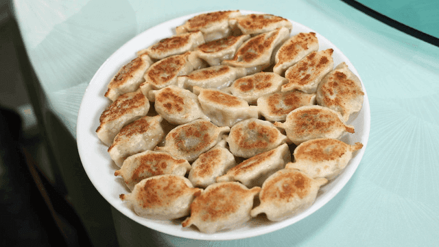 Plate full of crispy fried dumplings