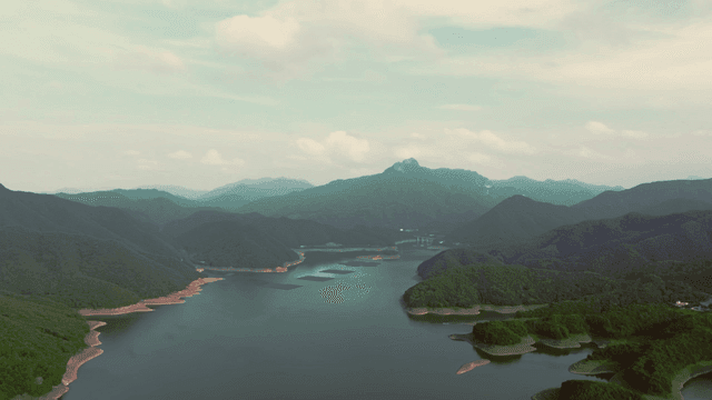 Tranquil lake surrounded by mountains