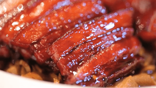 Glossy Red braised pork belly on a plate