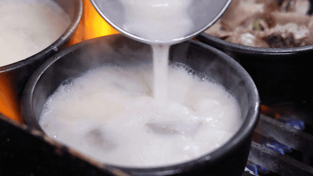 Beef soup boiling hot in earthenware pot