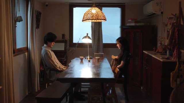 Couple sitting at a table indoors