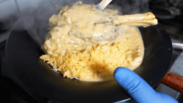 Mansaf topped with rice and lamb leg