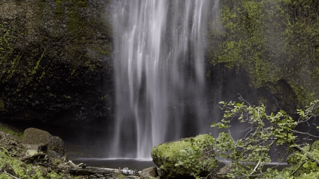 A serene waterfall cascading down rocks