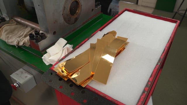 Metal sheets being processed in a factory