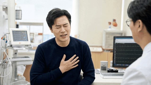 Male patient consulting with doctor at clinic