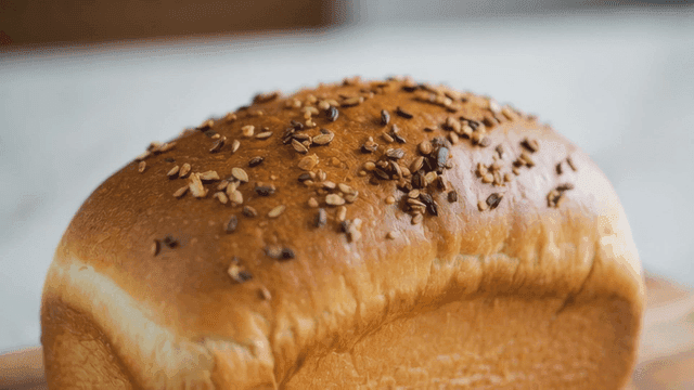 Freshly baked loaf of bread with seeds