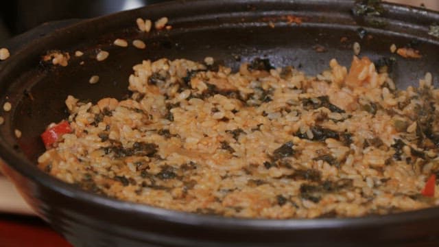 Cooking delicious fried rice in a frying pan