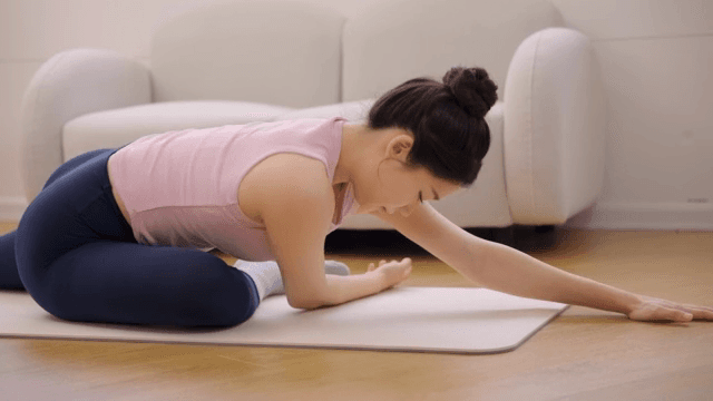 Woman practicing yoga indoors