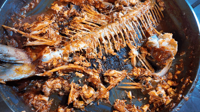 Spicy braised fish with only bones remaining