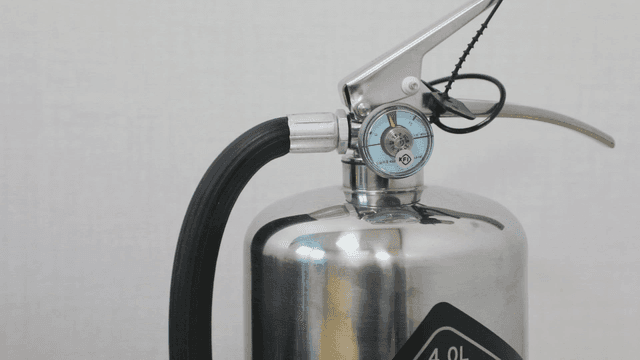 Close-up of a fire extinguisher indoors