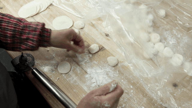 Person rolling dough with their hands