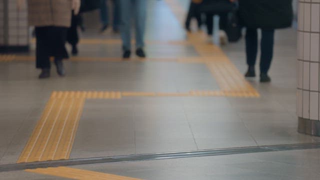 People walking in a busy subway station