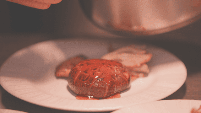 Gourmet grilled mushrooms with sauce drizzled on plate