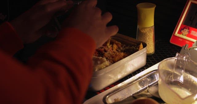 Person Enjoying a Meal in a Casual Setting