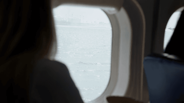 View from an airplane window over the sea