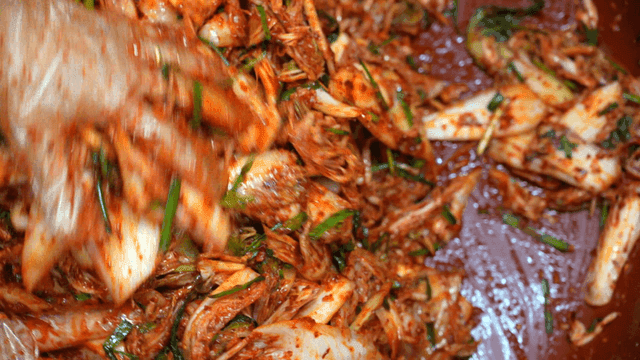 Mixing kimchi seasoning by hand