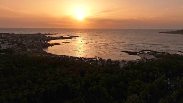 Sunset over a coastal town and beach